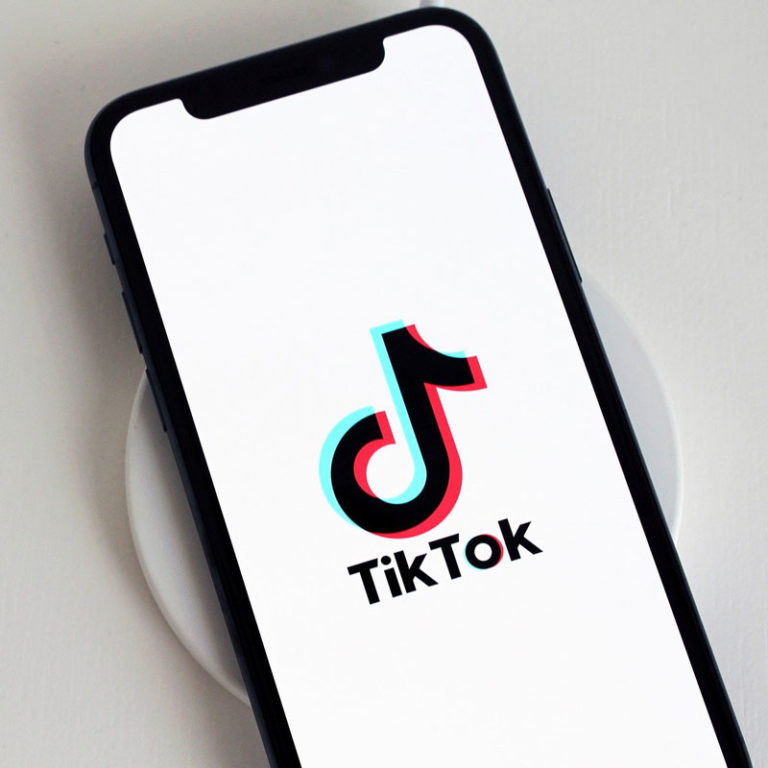 Phone on charger with TikTok app open