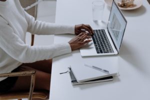 person typing on a computer keyboard