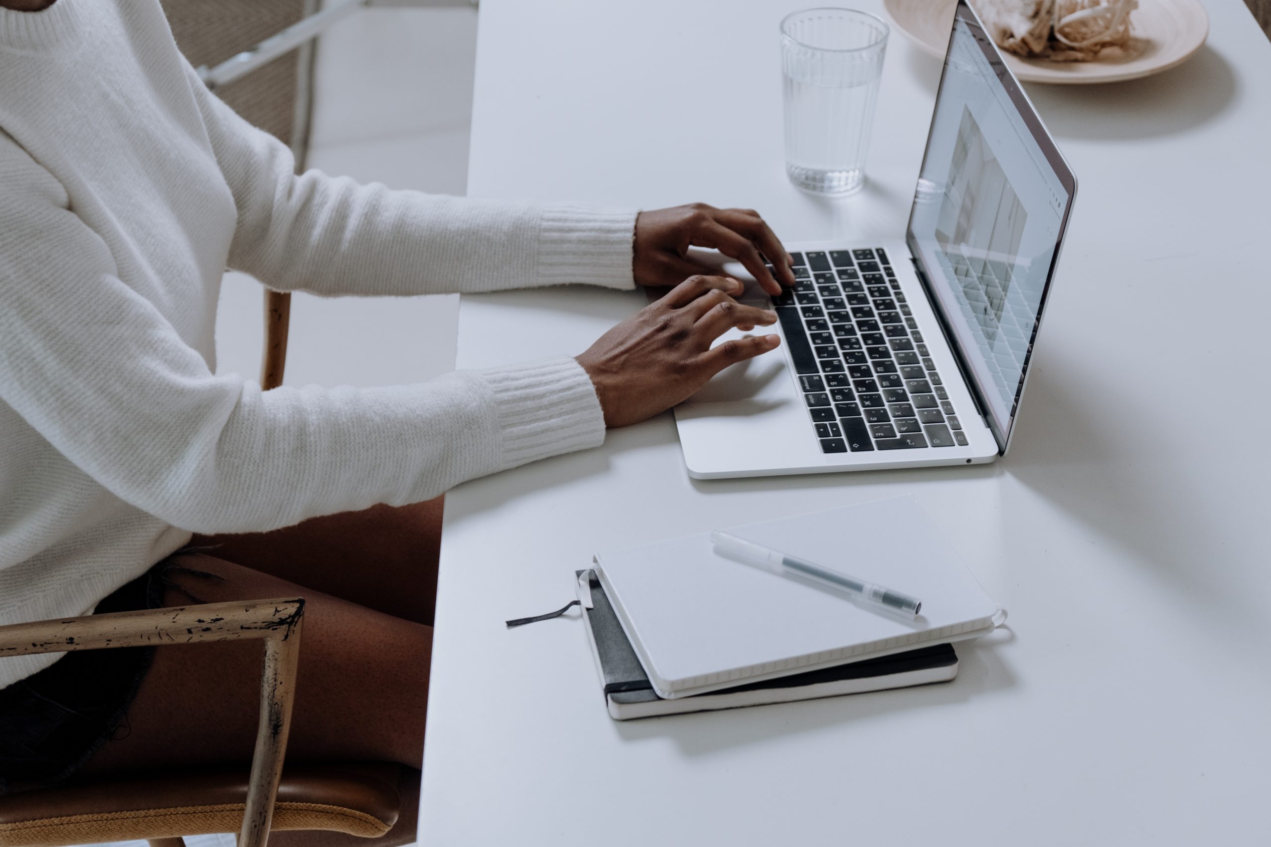 person typing on a computer keyboard