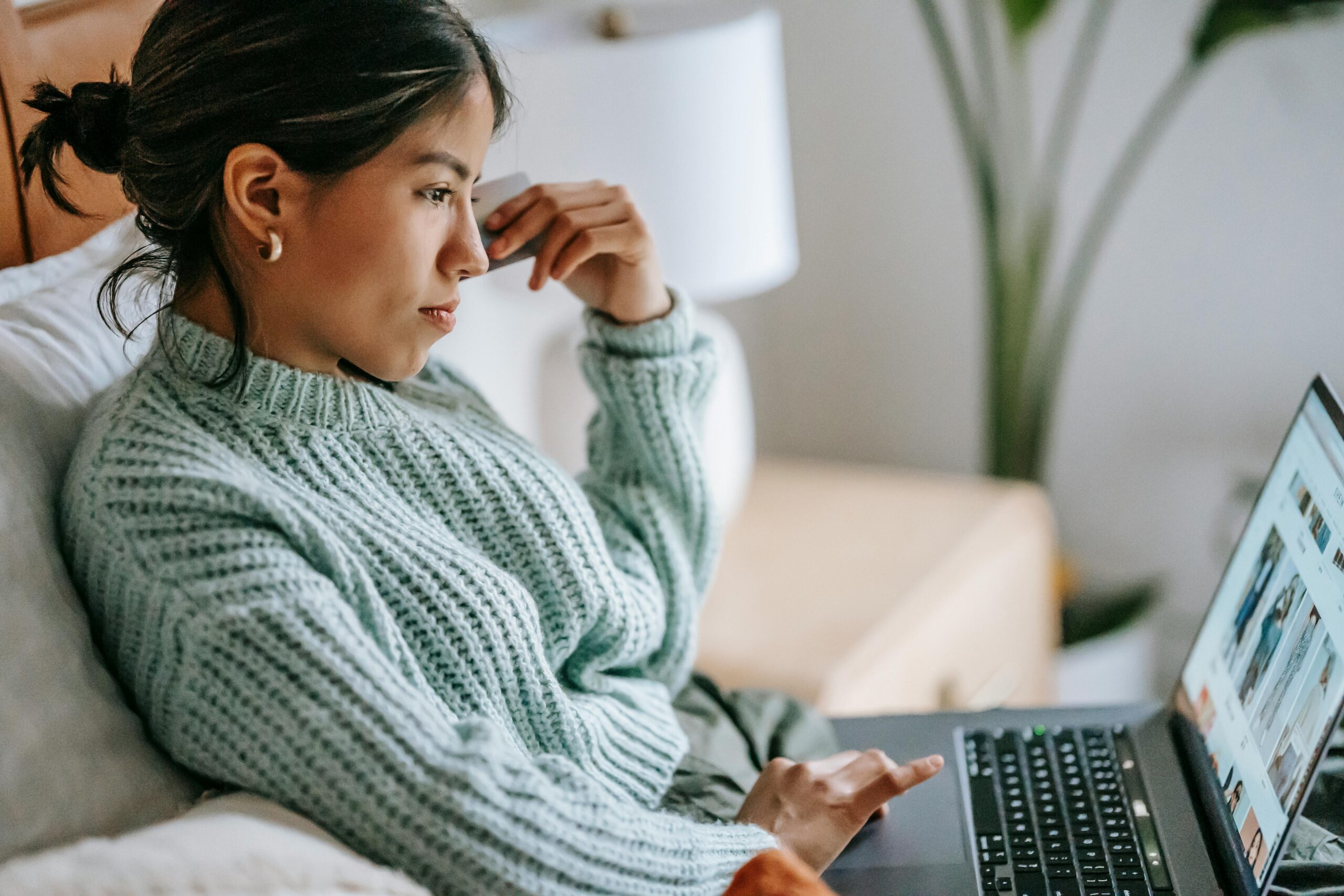 Woman sitting on the couch with her computer